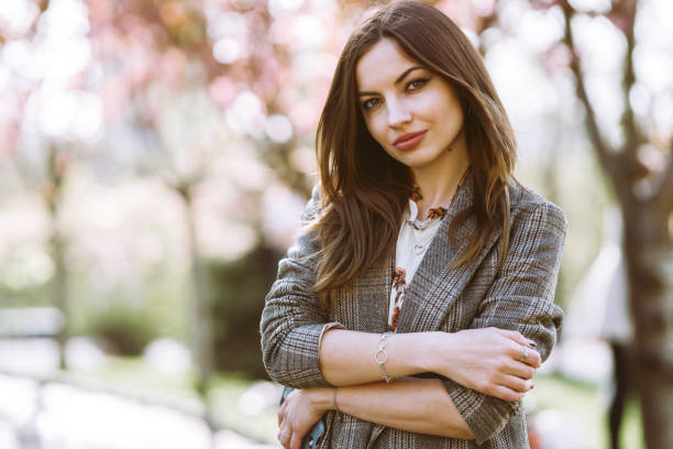 istock Beautiful young woman near the blooming spring tree. 1223446747