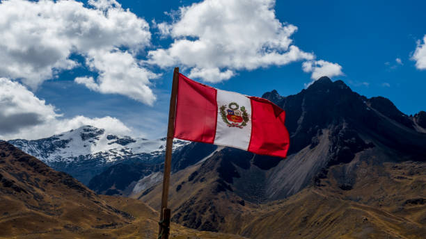 peruvian flag with mountain panorama peruvian flag with mountain panorama peru photos stock pictures, royalty-free photos & images