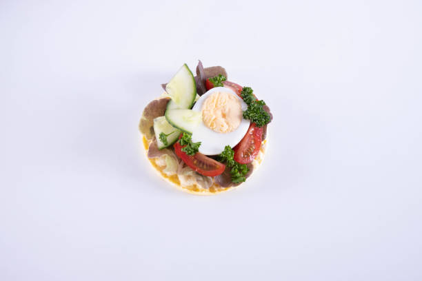 istock cucumber, tomato, salad and parsley on a corn waffle 1223451939