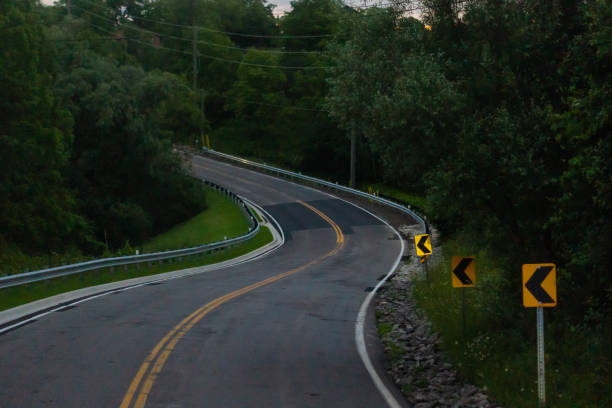 istock Curved Road through Rural Area 1223452553