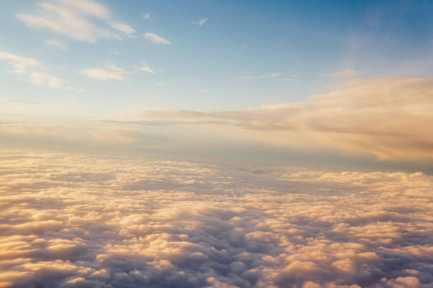 istock Sunset above the clouds landscape from an airplane journey 1223453788