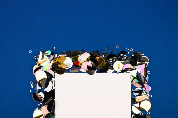 istock Creative layout made of sequins decor with blank card. A beautiful foundation for sites, layouts and postcards. Flat lay, top view 1223454967