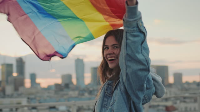 LGBT manifesto. Woman with rainbow flag