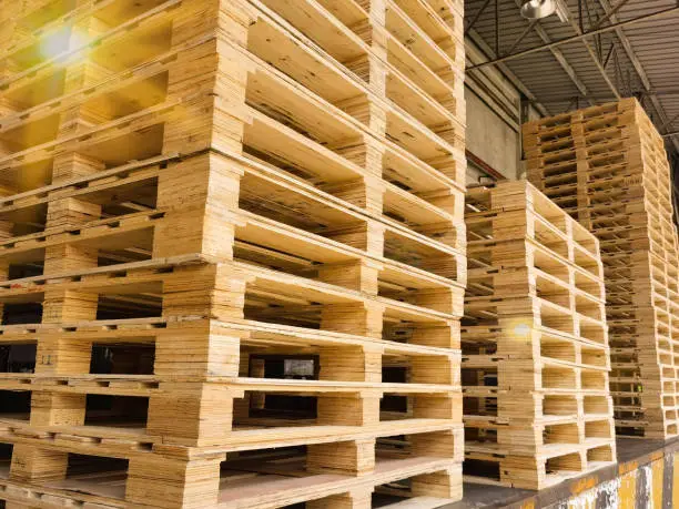 Wooden pallets stack at the freight cargo warehouse for transportation and logistics industrial