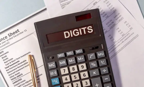 Photo of Calculator with DIGITS on display and pen on documents on blue table