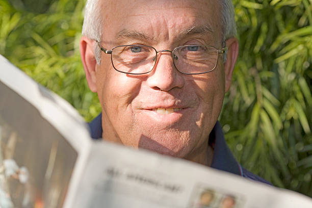 istock Man reads the newspaper 122347152