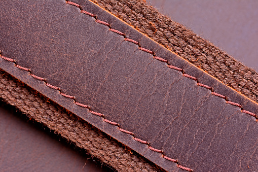 Wide leather belt belt stitched with threads close up
