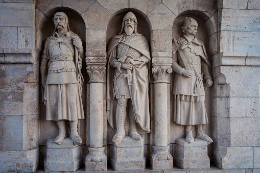 Budapest, Hungary - July 12, 2019: Arpad-era warrior statues guarding the gate of Fisherman's Bastion. Sculptor Franz Graf Mikhail, 1895-1902.