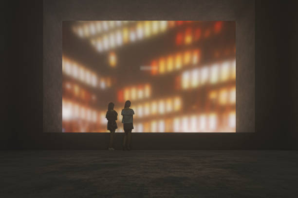 istock Two lonely women in concrete structure looking through window 1223477732