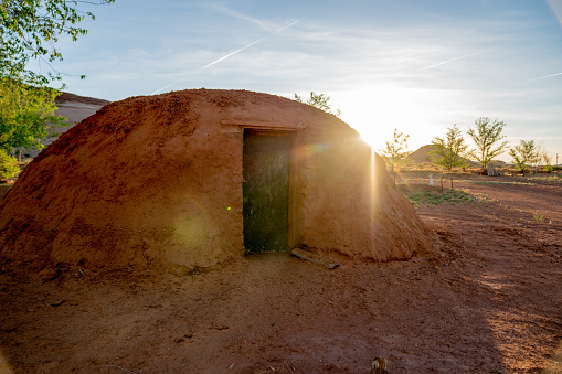 A Navajo family hogan at sunset, where they gather for family meals and family time
