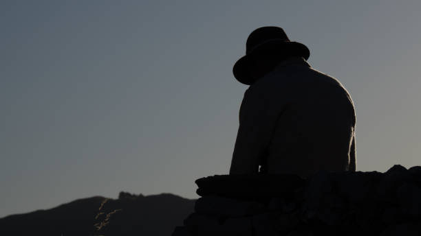 istock Silhouette of a man with hat 1223480907