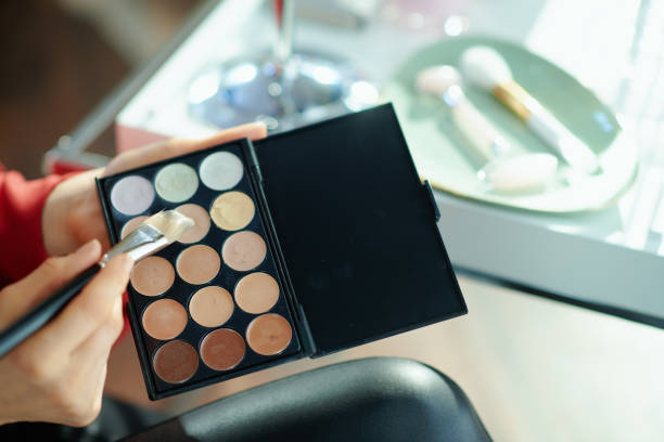istock female at home in sunny day using concealer palette 1223481014