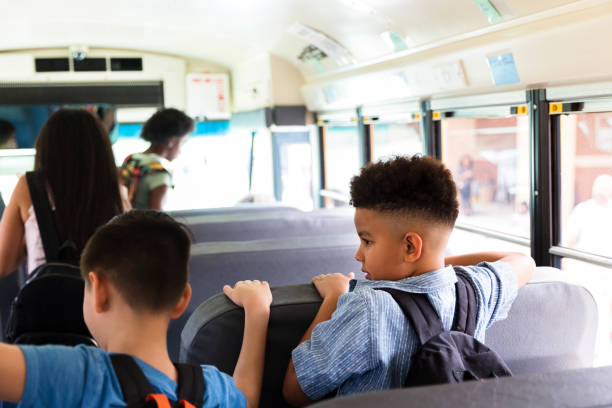 istock Young boys wait to get off school bus 1223481151