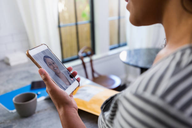 istock Woman having video chat with friend 1223481459