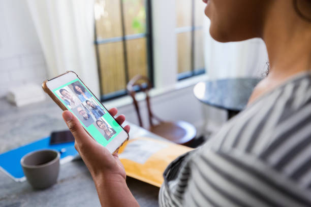 istock Woman talks with friends via video call 1223481479