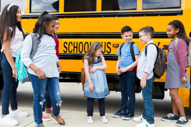 istock Group of students waiting for bus 1223481551