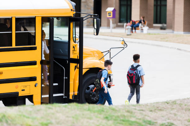 istock Schoolboys arriving on school campus 1223481560