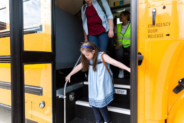 istock Young girl exits school bus 1223481571