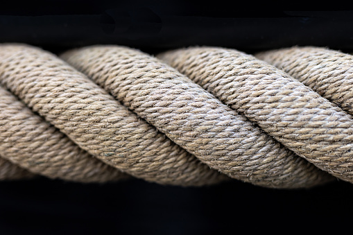 Climbing rope on dark background. Nylon rope