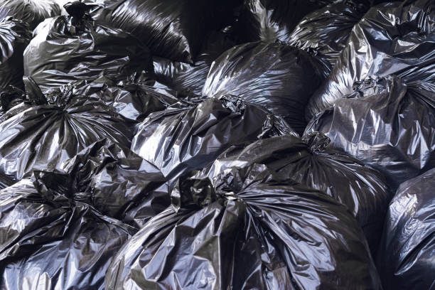 istock Black plastic garbage bags.Territory cleaning 1223482697