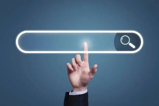 Photo of Search button on virtual screen pressed with finger or search engine search engine on the internet website