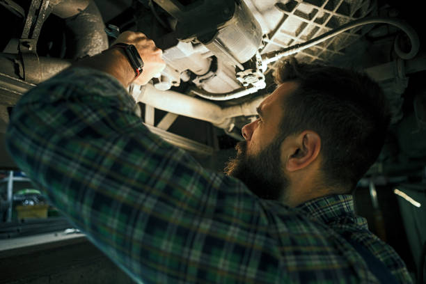 istock Male mechanic working below a truck 1223484123