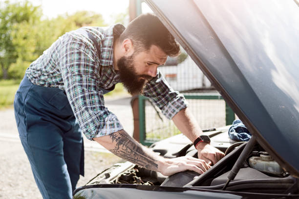 istock Mechanics fixing a car in a garage 1223484164