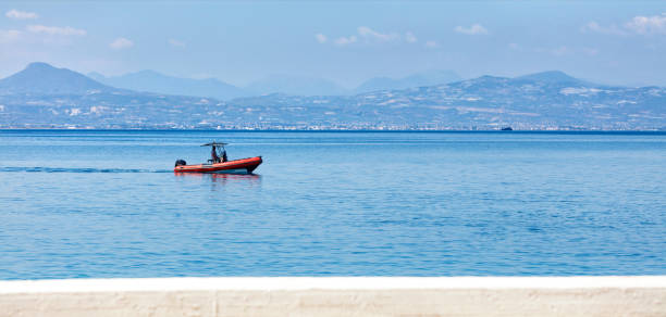 a rescue fast motor boat with a powerful motor patrols the coastline of the gulf of corinth. - gulf of corinth imagens e fotografias de stock