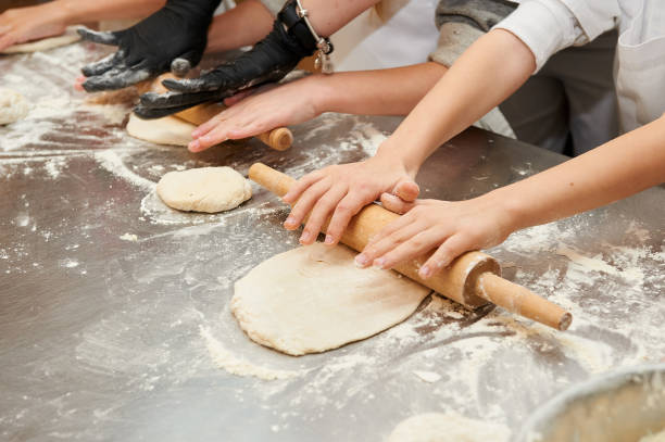 istock Young children make dough products. Hands closeup 1223486901