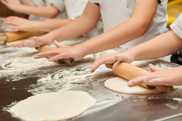 istock Young children make dough products. Hands closeup 1223486927