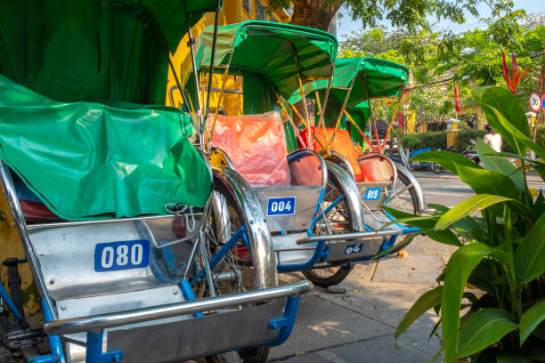 istock Three colourful rickshaws waiting for customers, Hoi An, Vietnam 1223488267