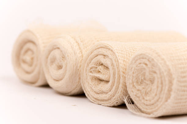 istock Bunch of new bandage rolls over white background 1223491330