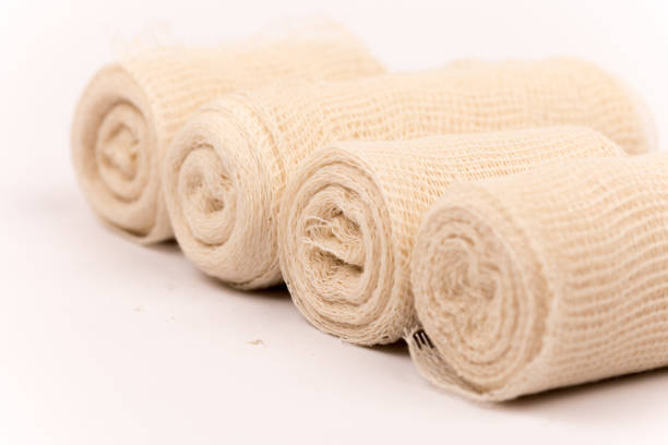istock Bunch of new bandage rolls over white background 1223491370