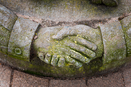 Handshake carved on stone in Stratfort upon Avon, United Kingdom