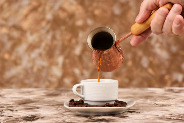 istock Pouring black coffee from cezve to a cup. 1223494157