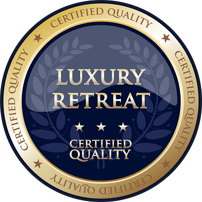 Luxury retreat certified quality gold round label with a laurel wreath.