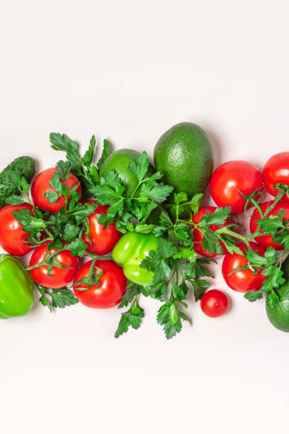 istock Fresh green and red vegetables on a light background, top view 1223495261
