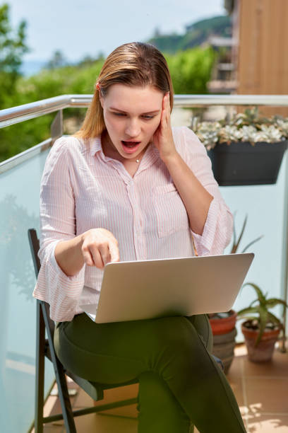 istock young beautiful woman using a laptop computer at home 1223495984