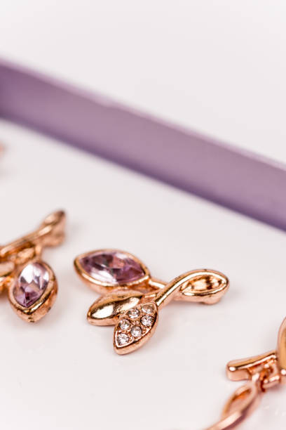 istock Macro image of golden earrings with diamond stones 1223498727