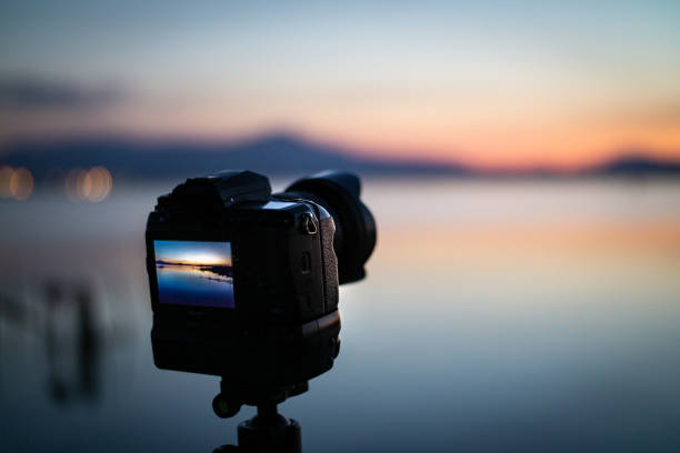 istock Landscape photoshoot camera on tripod at sunset 1223499754