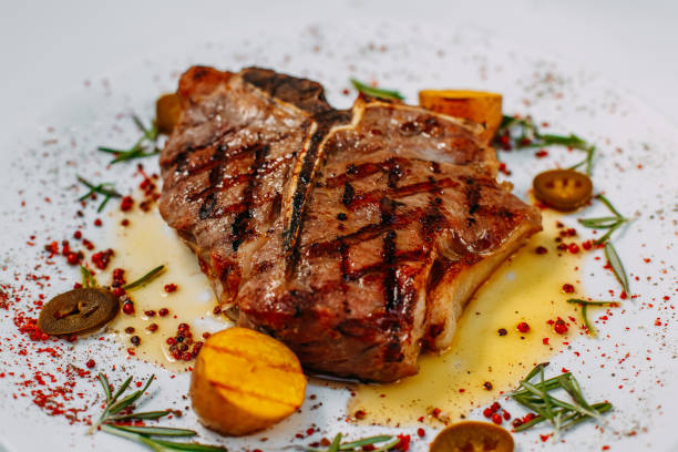 istock grilled beef steaks with spices isolated on white background 1223501246
