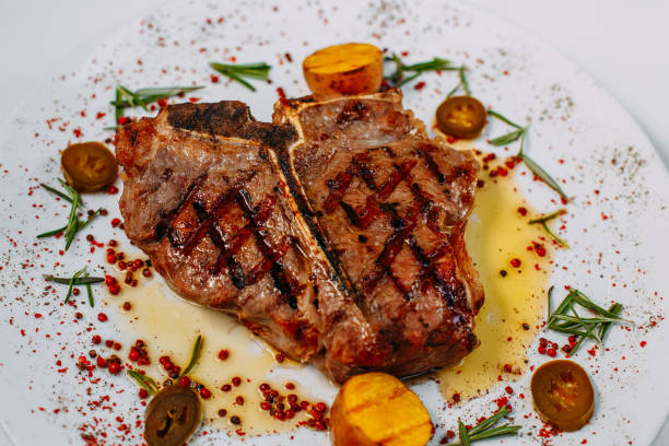 istock grilled beef steaks with spices isolated on white background 1223501265