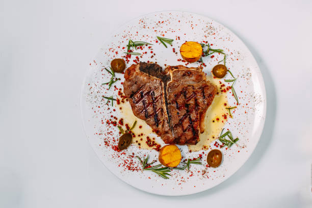 istock grilled beef steaks with spices isolated on white background 1223501336