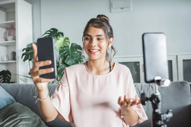 Photo of Teenage girl at home vlogging