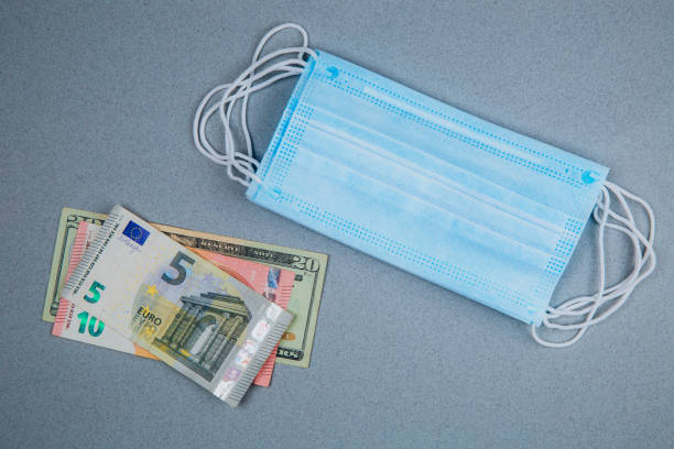istock Medical face mask and money 1223502530