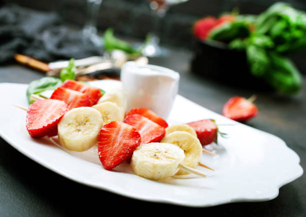 istock banana with strawberry 1223502775