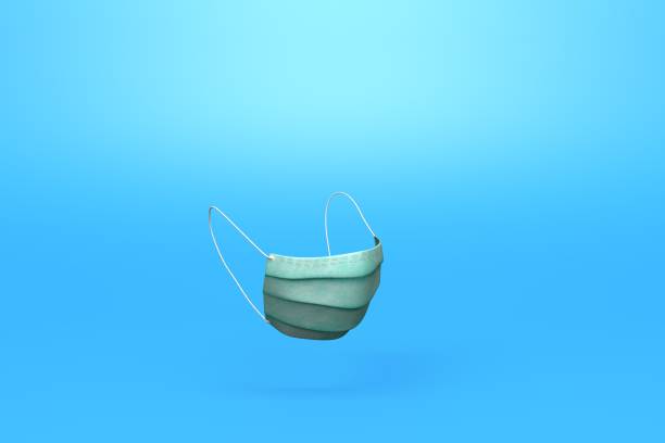 istock Medical protective face masks on blue surface stock photo 1223503604