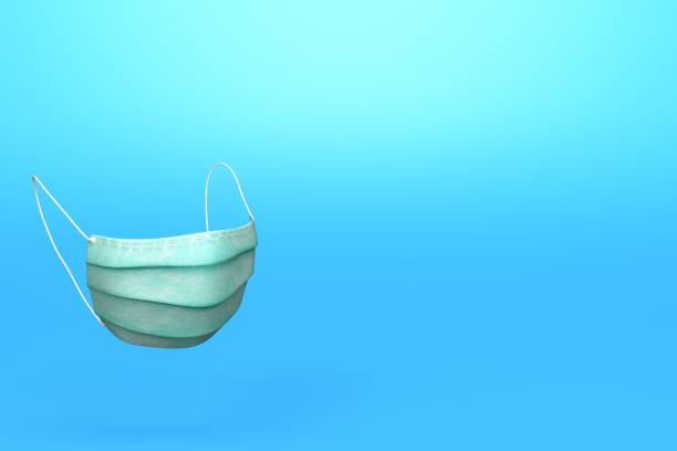 istock Medical protective face masks on blue surface stock photo 1223503652