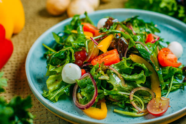 istock fresh vegetable salad, healthy food on a decorated table 1223504815