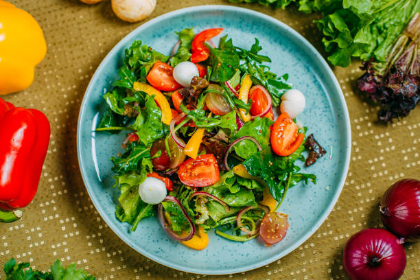 istock fresh vegetable salad, healthy food on a decorated table 1223504848